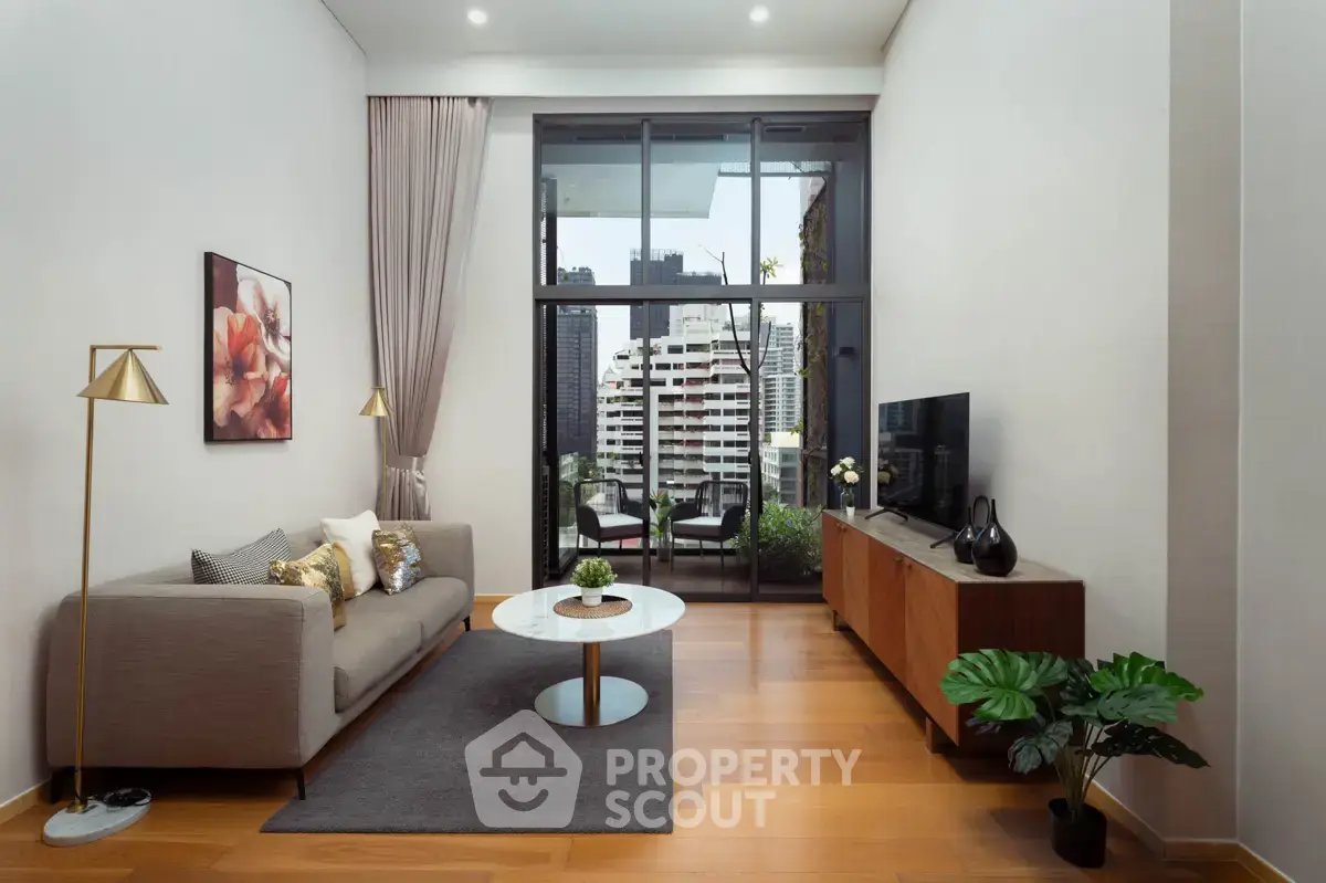 Modern living room with city view, elegant decor, and spacious layout.