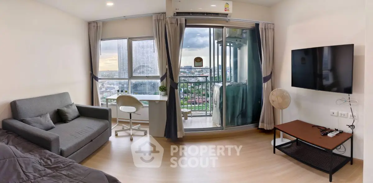 Modern living room with city view, featuring a cozy sofa, wall-mounted TV, and a small balcony.