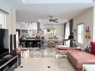 Spacious modern living room with open kitchen and stylish decor