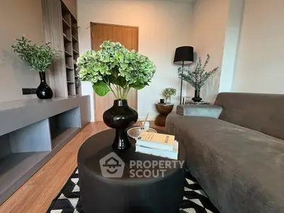 Stylish living room with modern decor and cozy seating area, perfect for relaxation and entertainment.