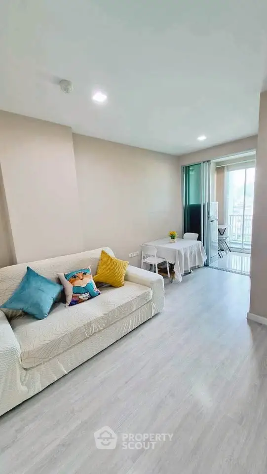 Bright and airy living room with modern decor and balcony access