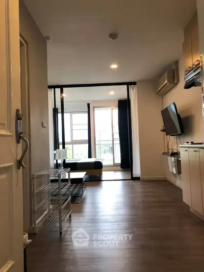 Modern apartment interior with open layout and balcony view