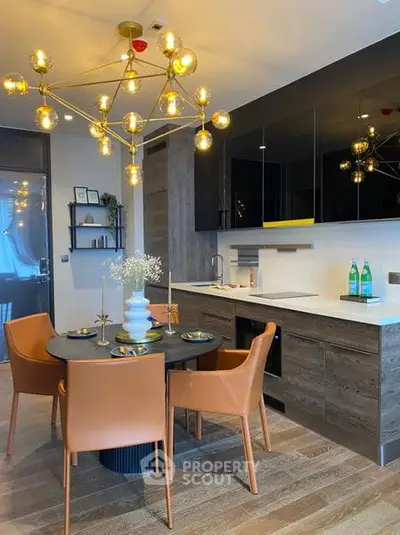 Modern kitchen with elegant dining area and stylish lighting