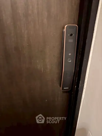 Modern smart lock on a sleek wooden door for enhanced security