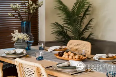 Elegant dining area with stylish table setting and decorative plants