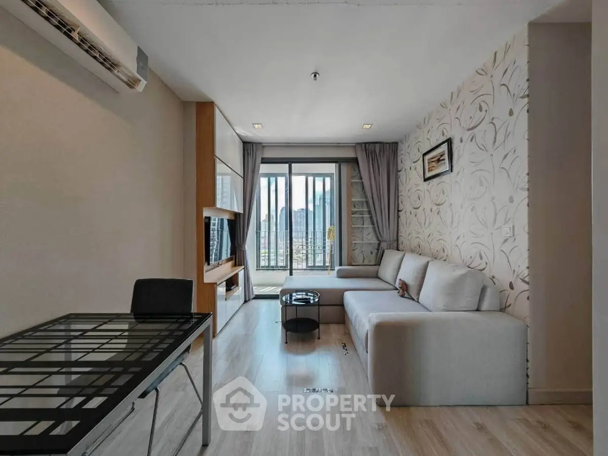 Modern living room with stylish decor and balcony view