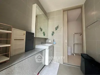 Modern bathroom with sleek design and ample storage space