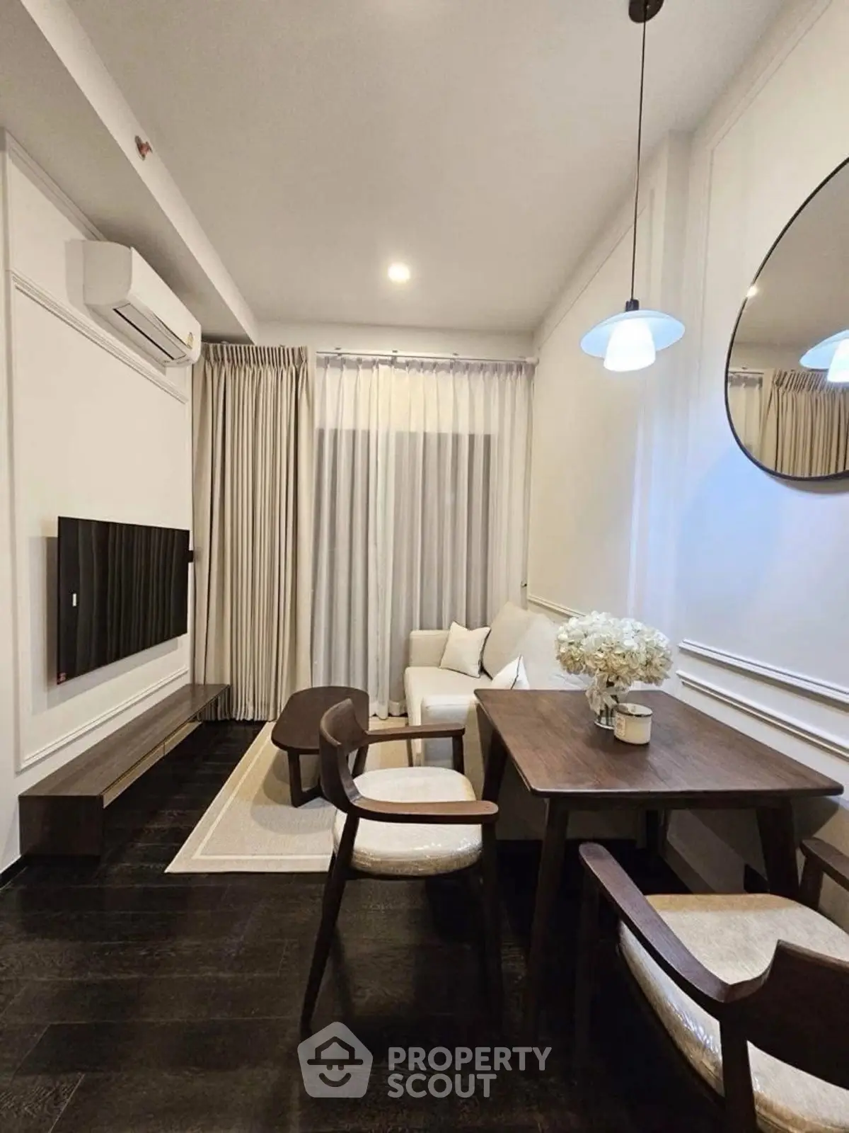 Stylish modern living room with elegant furniture and soft lighting.