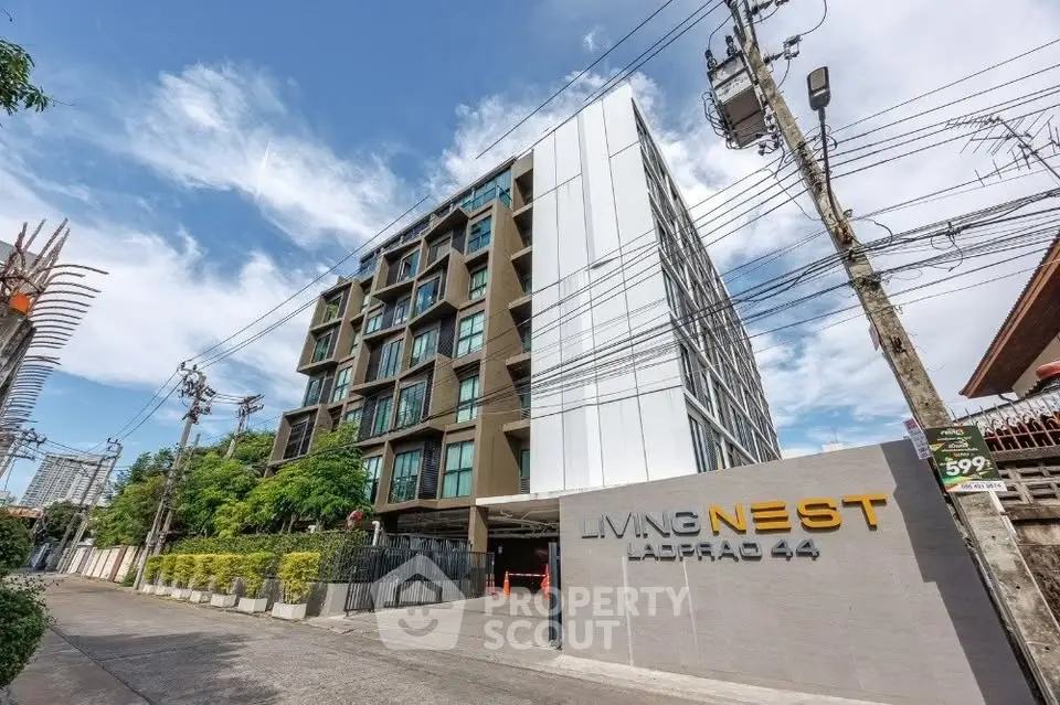 Modern apartment building with sleek design at Living Nest Ladprao 44