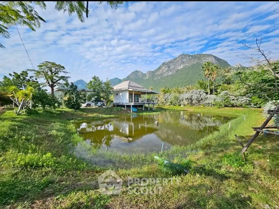 Charming rural property with scenic mountain view and serene pond