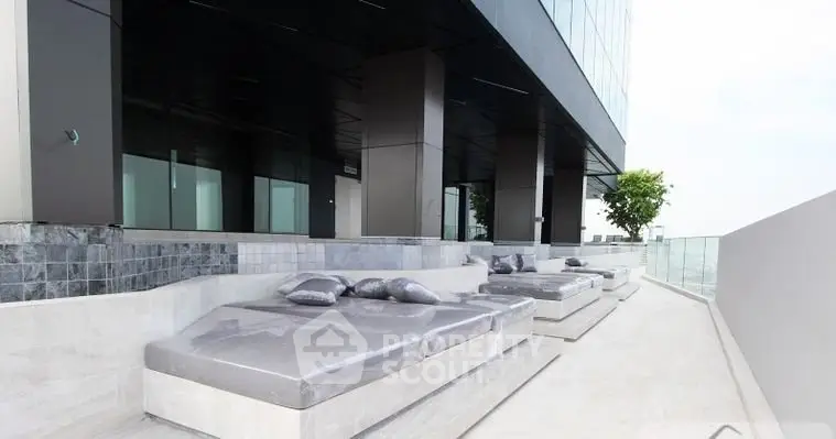 Luxurious rooftop terrace with modern lounge seating and stunning views.