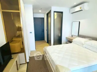 Modern bedroom with air conditioning and stylish decor in a contemporary apartment.