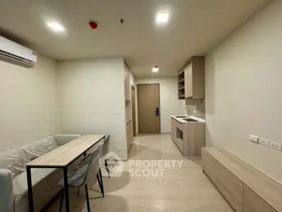 Modern apartment interior with sleek kitchen and dining area