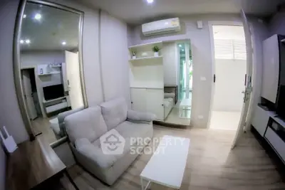 Modern living room with cozy sofa and stylish decor in a contemporary apartment.