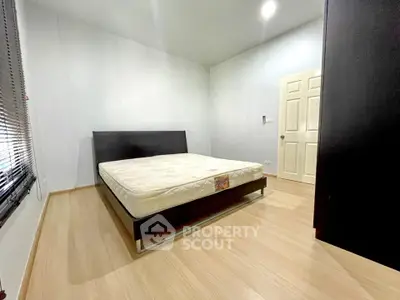 Spacious bedroom with minimalist design and natural light