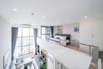 Stunning modern loft apartment with floor-to-ceiling windows and elegant interior design.