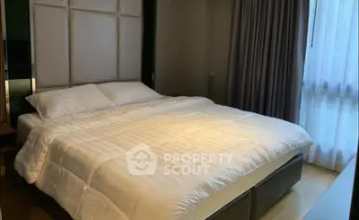 Luxurious bedroom with elegant decor and large window for natural light