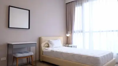 Cozy bedroom with modern decor and natural light