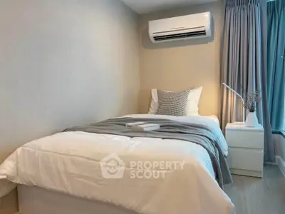 Cozy bedroom with modern air conditioning and stylish decor