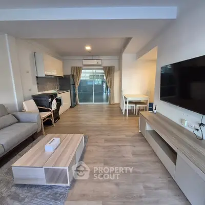 Modern living room with open kitchen and stylish decor