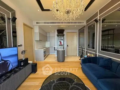 Luxurious living room with elegant chandelier and modern open kitchen layout