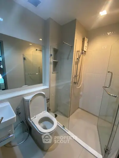 Modern bathroom with glass shower and sleek fixtures