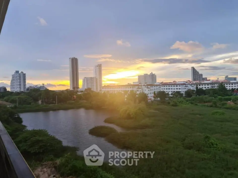 Stunning sunset view over city skyline and lush greenery