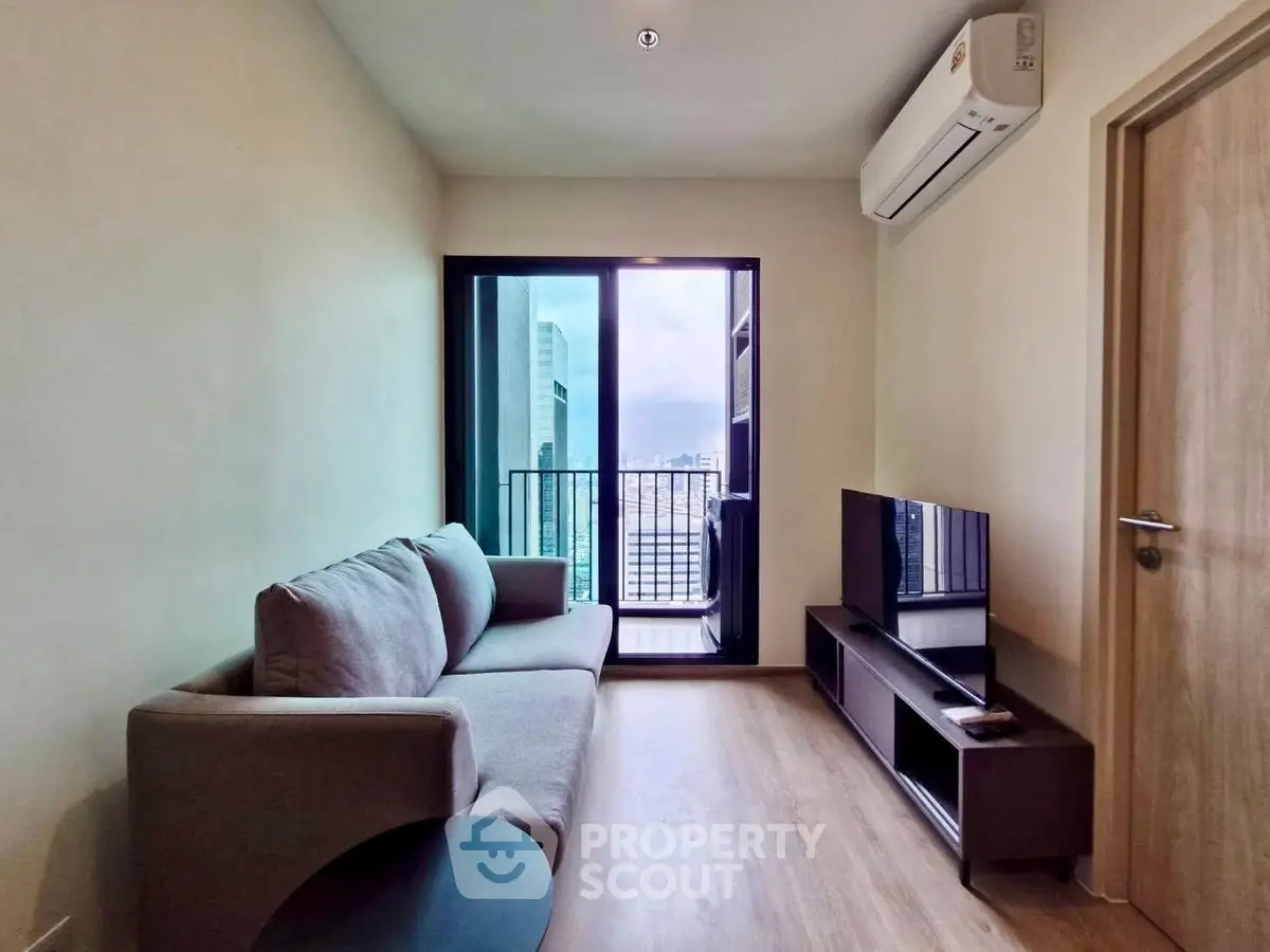 Modern living room with balcony view in high-rise apartment