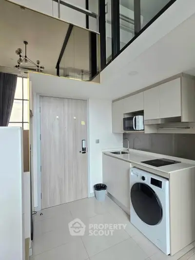 Modern kitchen with sleek appliances and loft design in a stylish apartment