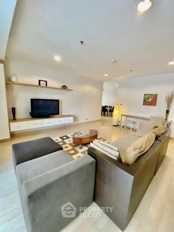 Spacious modern living room with stylish furniture and open layout