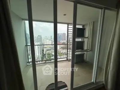 Spacious balcony with stunning city view in modern high-rise apartment