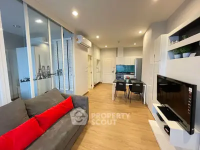 Modern open-plan living room with stylish kitchen and cozy seating area