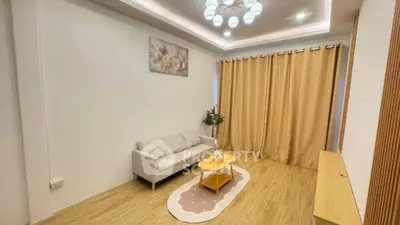 Elegant living room with modern lighting and cozy sofa, perfect for relaxation.