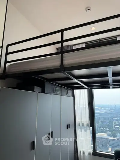 Modern loft bedroom with city view and sleek storage solutions