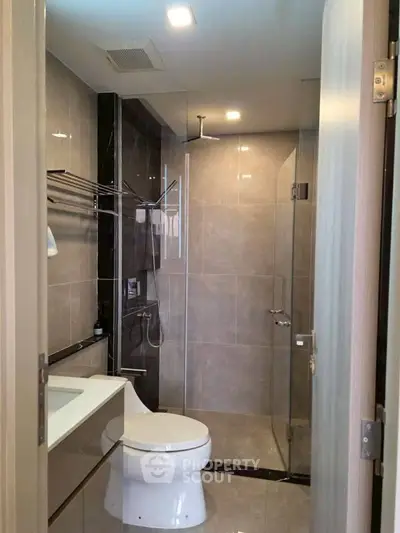 Modern bathroom with glass shower and sleek fixtures