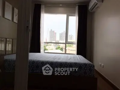 Cozy bedroom with city view and modern air conditioning unit.