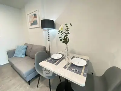 Cozy modern living room with stylish furniture and dining area