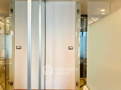 Modern bathroom with glass shower doors and sleek design
