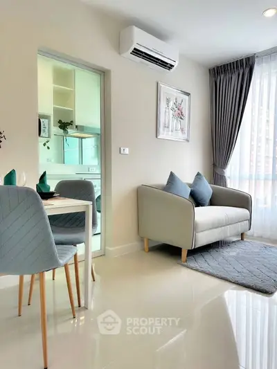 Modern living room with cozy sofa, dining area, and air conditioning in a bright apartment.