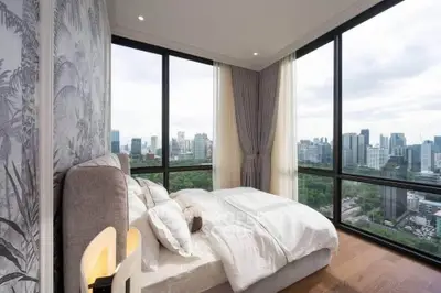Luxurious bedroom with panoramic city view and elegant decor