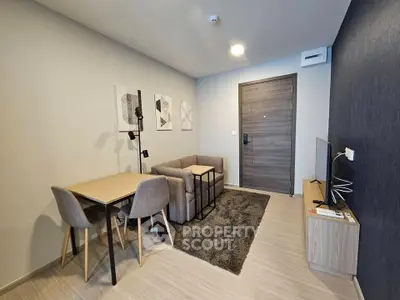 Modern living room with cozy seating and stylish decor in a contemporary apartment.