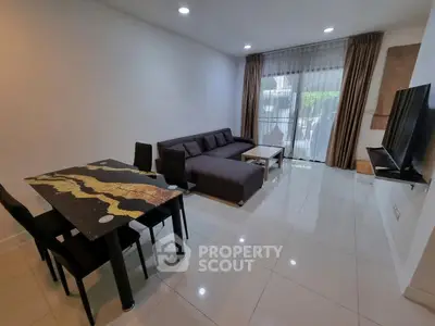 Spacious modern living room with sleek furniture and large windows