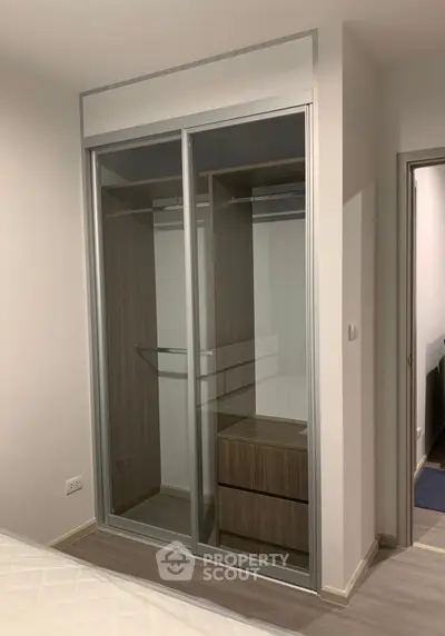 Modern bedroom with sleek sliding door wardrobe and minimalist design