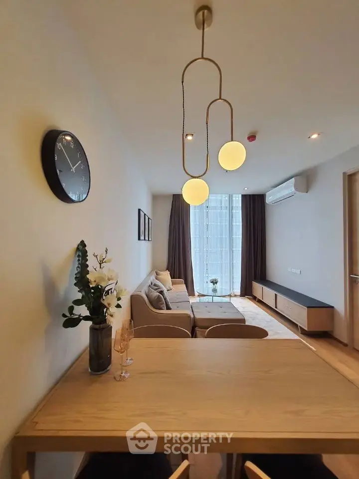 Modern living room with stylish lighting and cozy seating area.