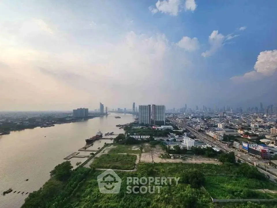 Stunning cityscape view with river and skyline, perfect for urban living enthusiasts.