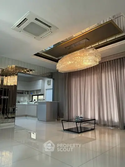 Luxurious living room with elegant chandelier and modern decor