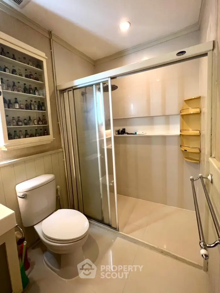 Modern bathroom with glass shower and sleek fixtures
