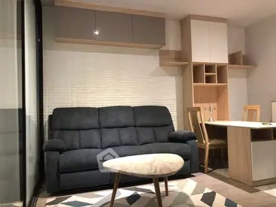 Modern living room with cozy sofa and stylish furniture in a contemporary apartment.