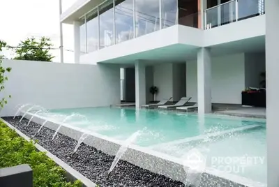 Luxurious modern home with stunning swimming pool and sleek architectural design