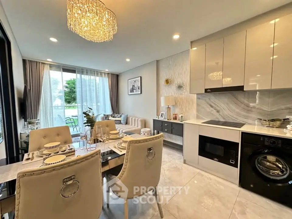 Luxurious open-plan living room and kitchen with elegant decor and modern appliances